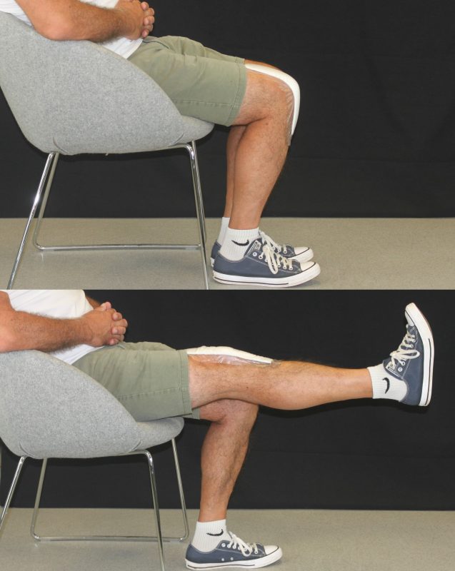 man sat on a chair stretching out one leg straight