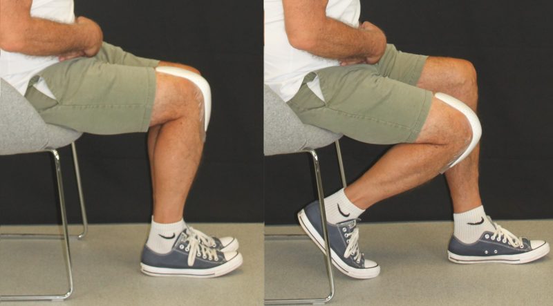 man sat on a chair with one leg bent